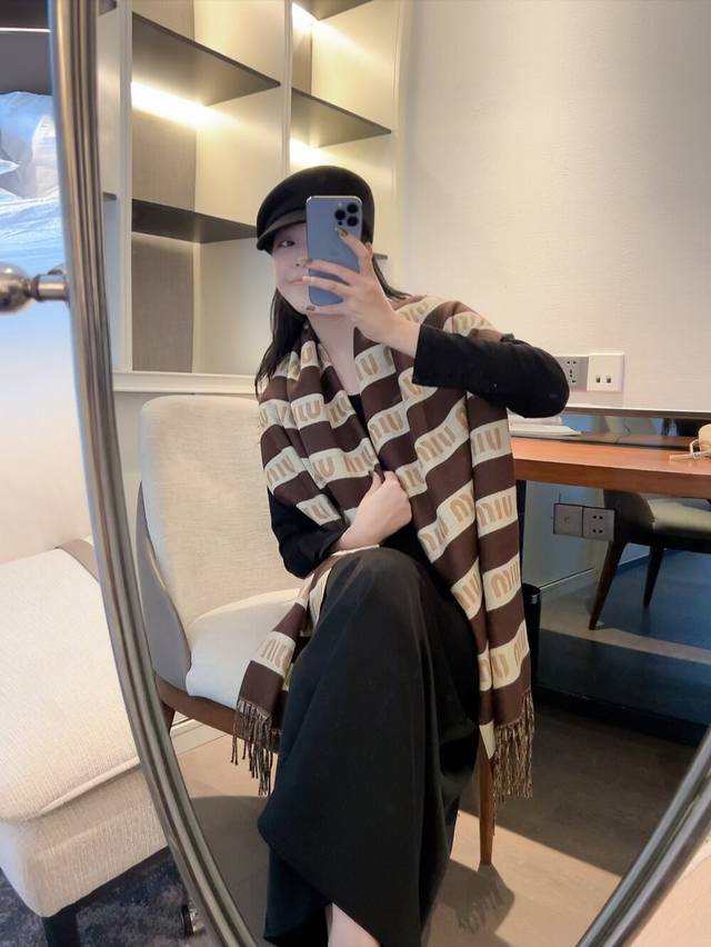 A warm and high-quality cashmere scarf from Miu Miu, perfect for keeping you coz