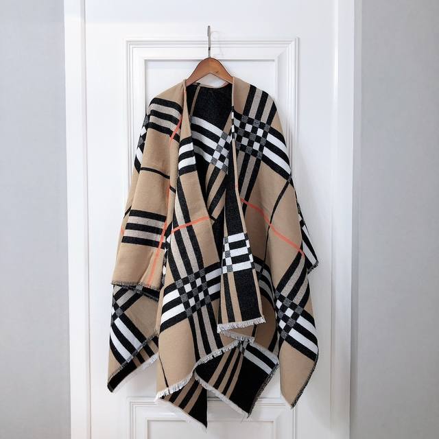 Burberry shawl/cape. This oversized wool shawl in a plaid pattern looks incredib