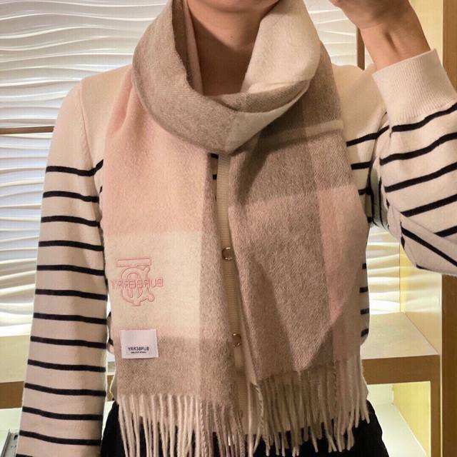 Burberry. Highly recommend this men's and women's scarf! A rare find