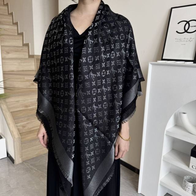 This Louis Vuitton square scarf/shawl features classic gold thread paired with a