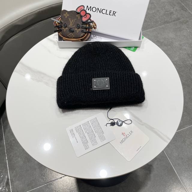 Moncler beanie, a classic and versatile style.