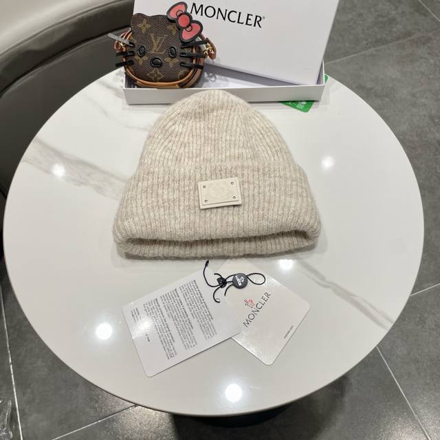 Moncler beanie, a classic and versatile style.
