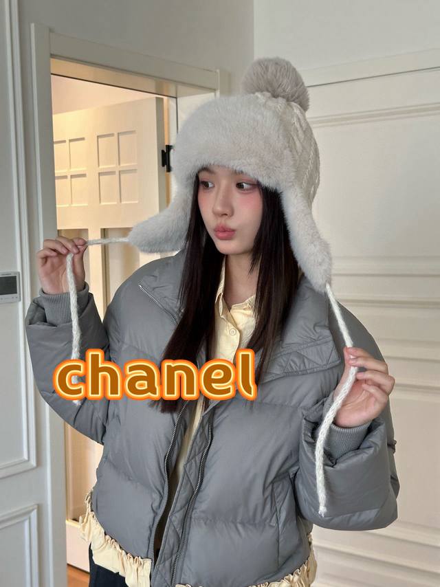 Chanel plush earflap hat with classic double C logo design. The hat body is made
