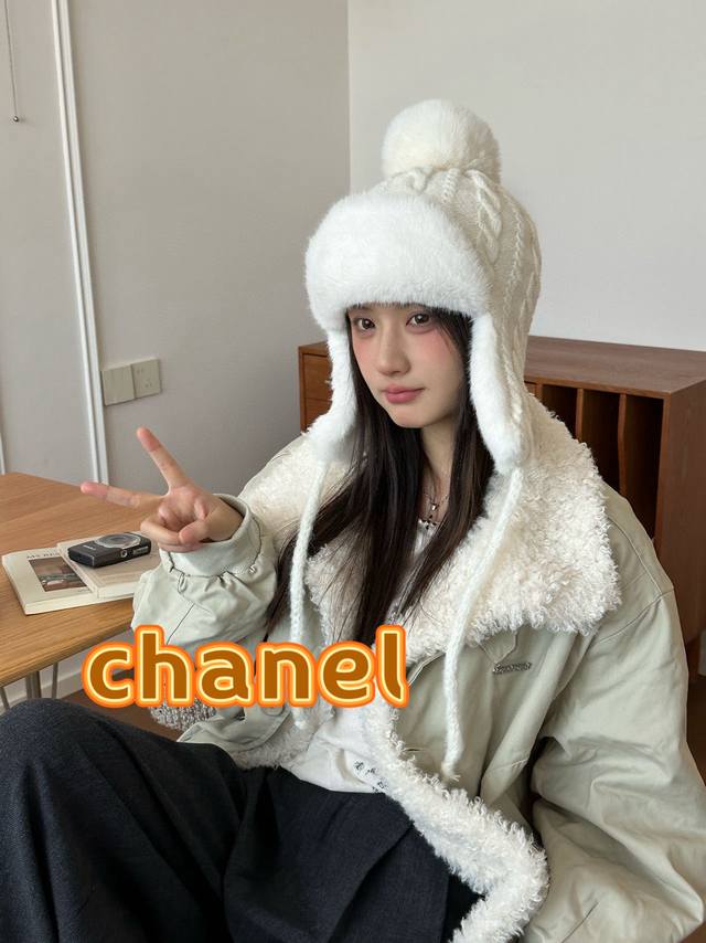 Chanel plush earflap hat with classic double C logo design. The hat body is made