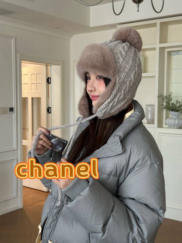Chanel plush earflap hat with classic double C logo design. The hat body is made