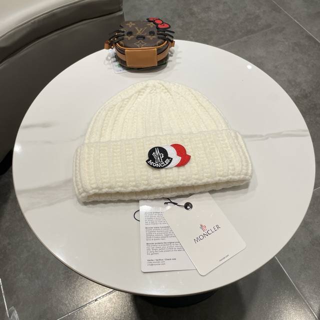 Moncler knitted beanie, comes with QR code. High-quality, sophisticated, and inc