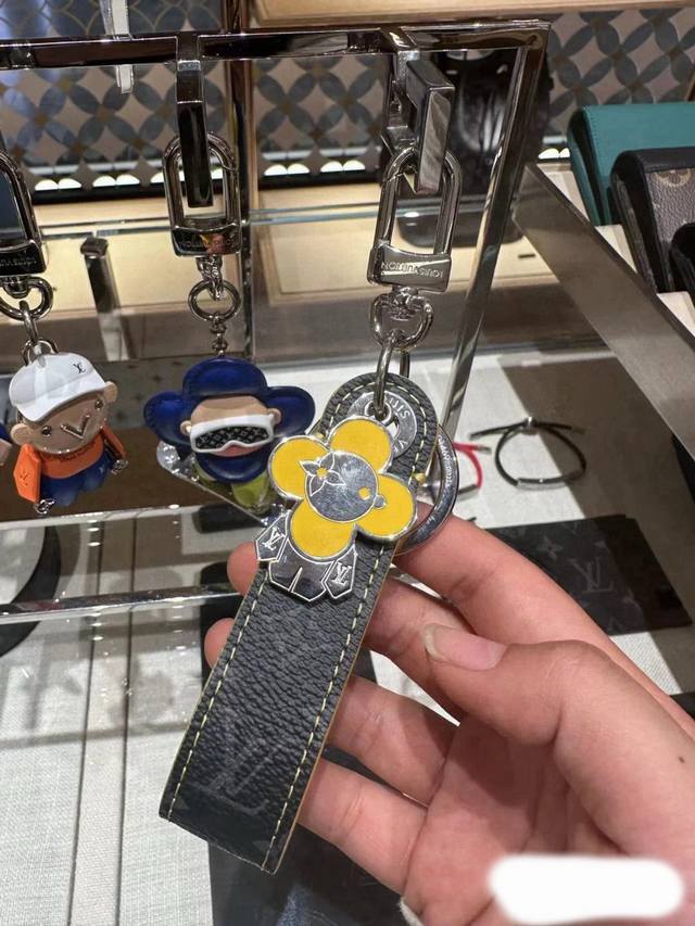 LV keychain sun doll bag charm original accessory. The Vivienne Dragonne bag cha
