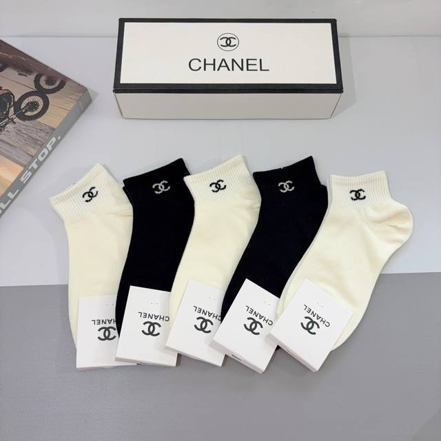 A box of 5 pairs of Chanel classic socks with packaging. High-quality bamboo cot