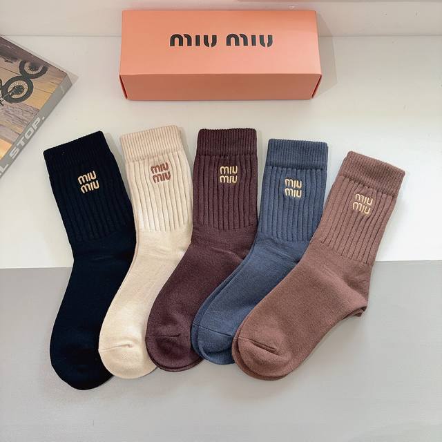 A box of 5 pairs of Miu Miu high-quality embroidered cashmere knee-high socks, a