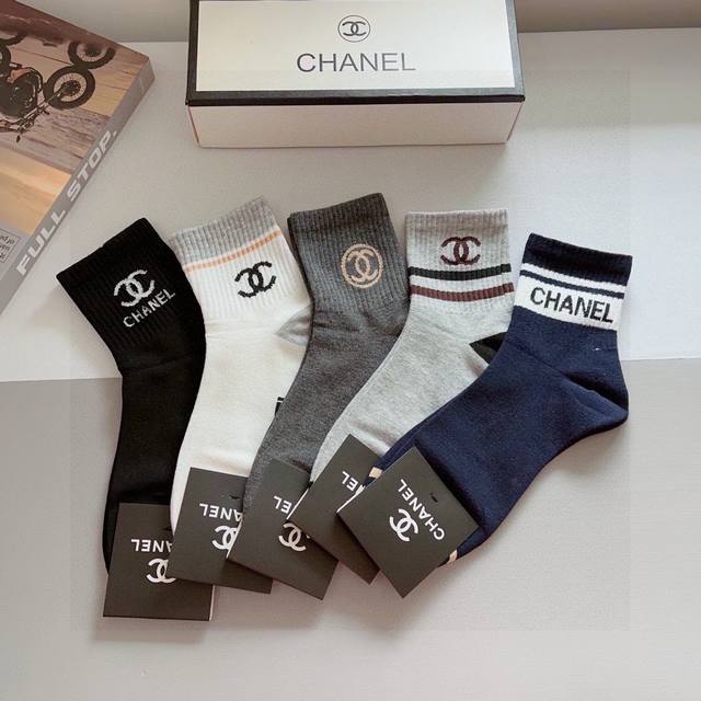 A box of 5 pairs of Chanel classic mid-length socks with packaging. High-quality