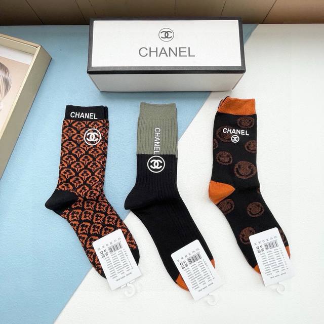 A box of three pairs of Chanel socks, including packaging