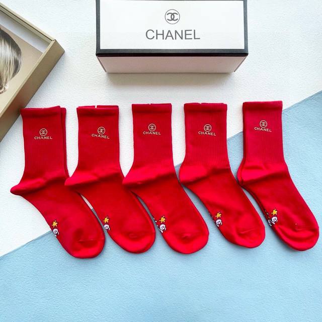 A box of five Chanel red New Year's socks, same style as the official website, w