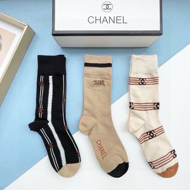 A box of four pairs of Chanel high-quality, super popular trending socks, featur