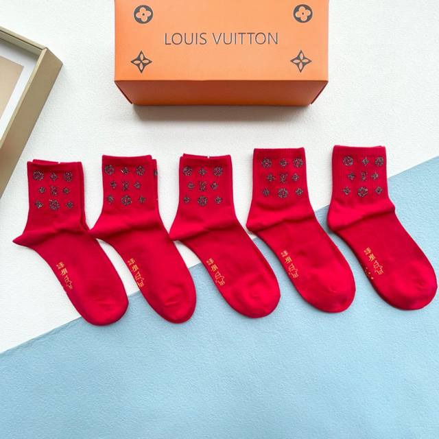 A box of five pairs of Louis Vuitton mid-calf socks, a hot-selling style for Chi