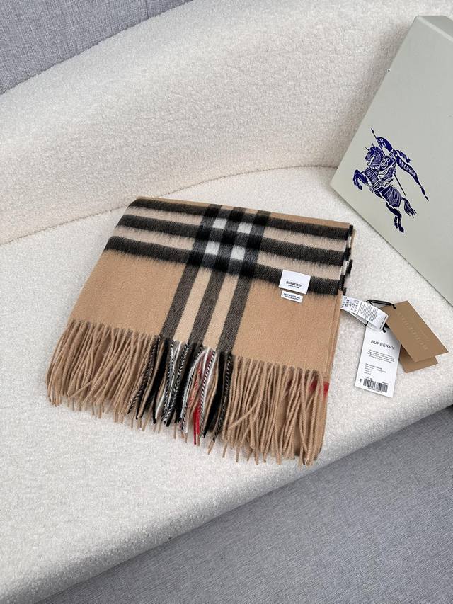 B Brand. A Burberry shearling shawl is actually more practical than a trench coa