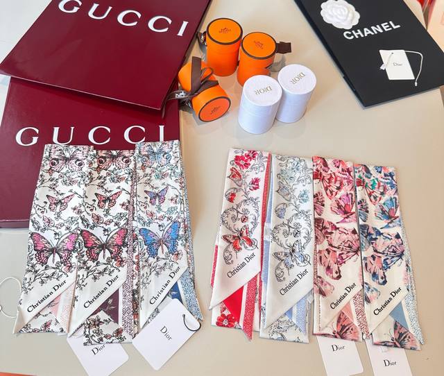 This white and pale pink mulberry silk jacquard Mitzah scarf, adorned with the