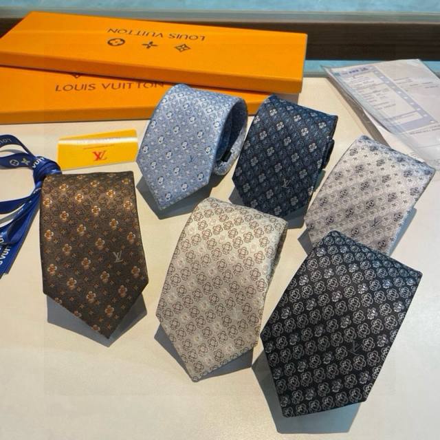 This tie features the same exquisite small logo jacquard weave as those found i
