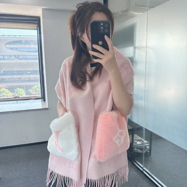 This classic Louis Vuitton cashmere scarf/shawl continues the winter classic st