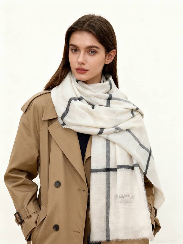 A steal! Burberry's classic design is back with a unique two-tone patchwork cust