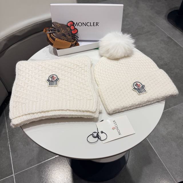Moncler. Great deal on a two-piece scarf and hat set! Simple and stylish, this