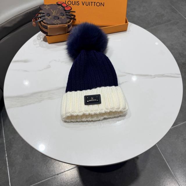 LV Louis Vuitton. Classic beanie with a large leather label! A winter favorite f