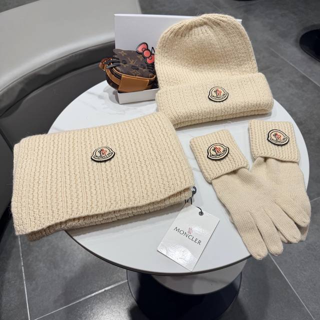 Moncler. Three-piece wool set: fox fur hat, scarf, gloves, and classic matching