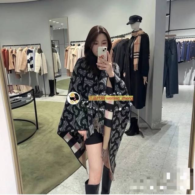 This is a high-quality Burberry cape, a double-sided jacquard cape/shawl with t