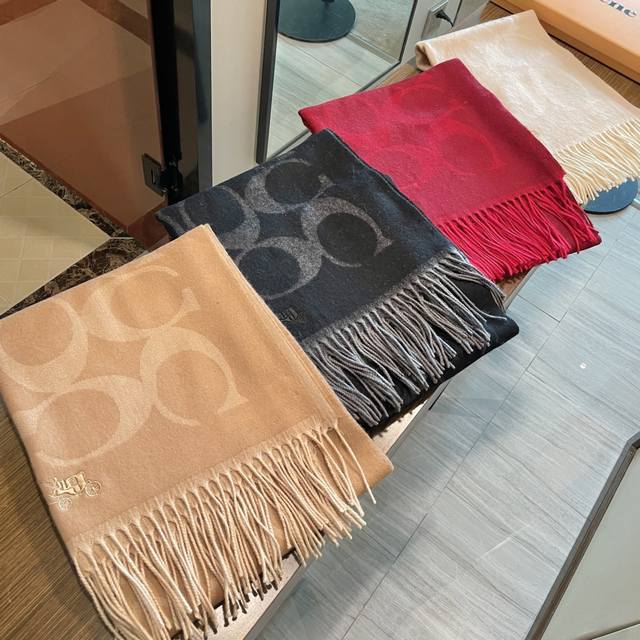 This high-quality classic Coach shawl is absolutely gorgeous! Not only is it sty