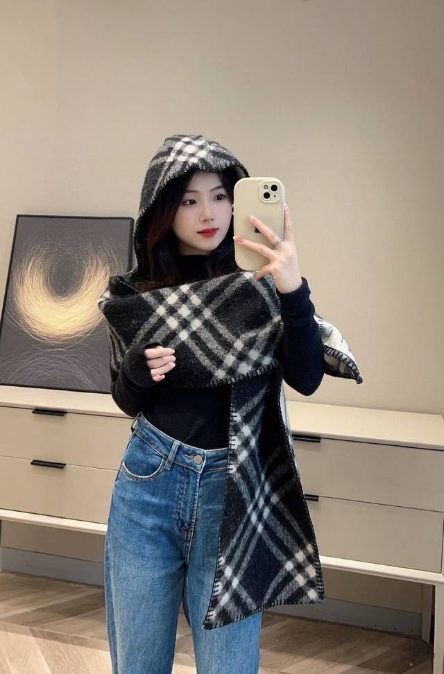 The latest Burberry signature hooded cape, a must-have for online influencers.