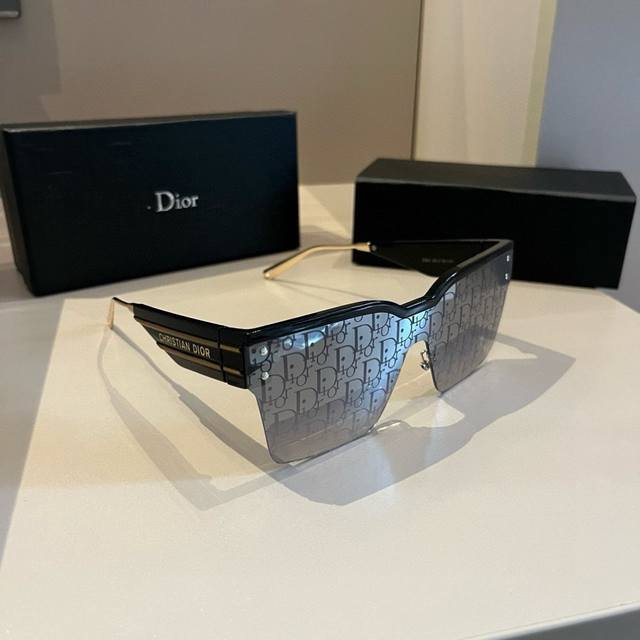 Dior's wildly popular Diorclub series sunglasses, as featured in the poster, are