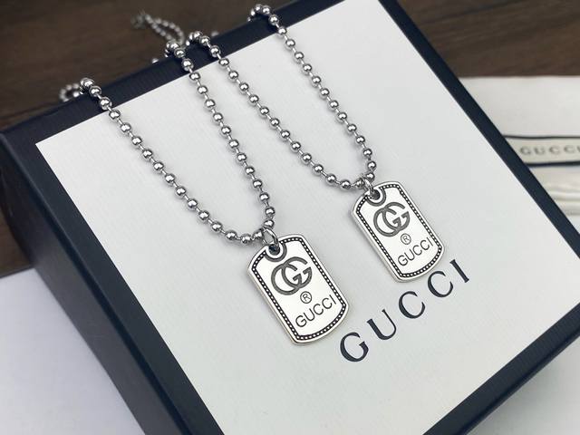 Gucci beaded square pendant necklace with unique double G logo engraved on the p