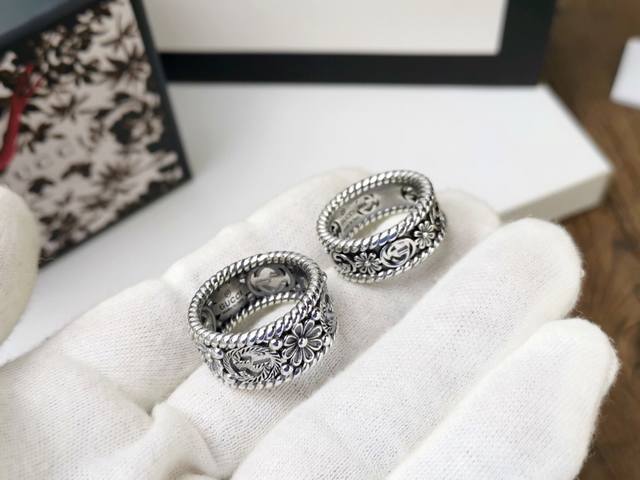 Various Gucci's new Interlocking G couple rings feature alternating floral and