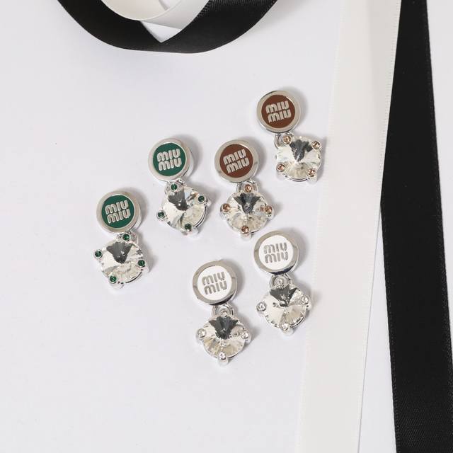 Miu Miu earrings: Miu Miu colored enamel button-shaped diamond pendant earrings