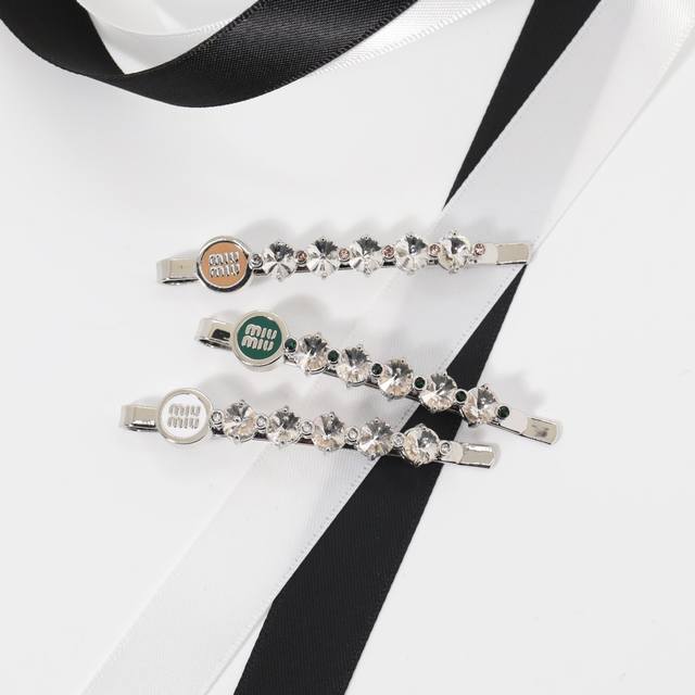 Miu Miu hair clip: A Miu Miu colored enamel and full-diamond bobby pin for women