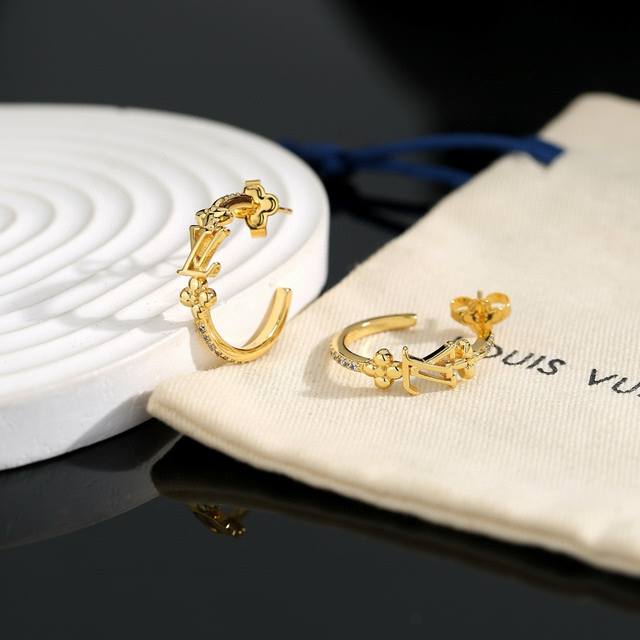 Exquisitely crafted Louis Vuitton earrings, embodying superb craftsmanship, use