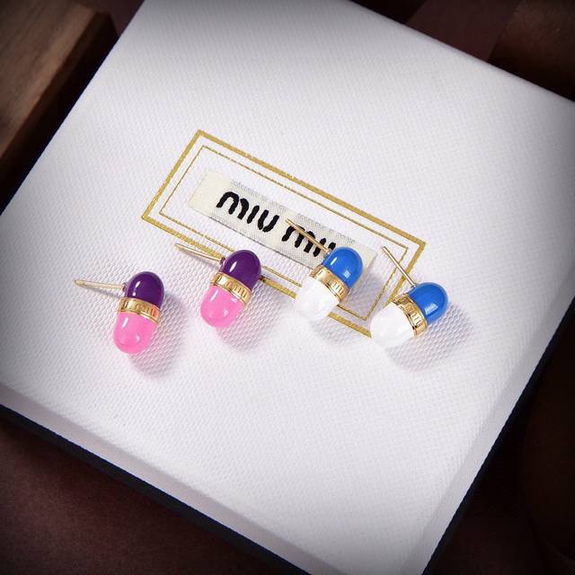 Miumiu's latest pill-shaped earrings from the Paris fashion show; these earrings