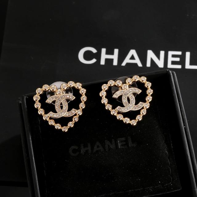 Chanel light gold heart earrings are a trendy early spring style. Whether you h