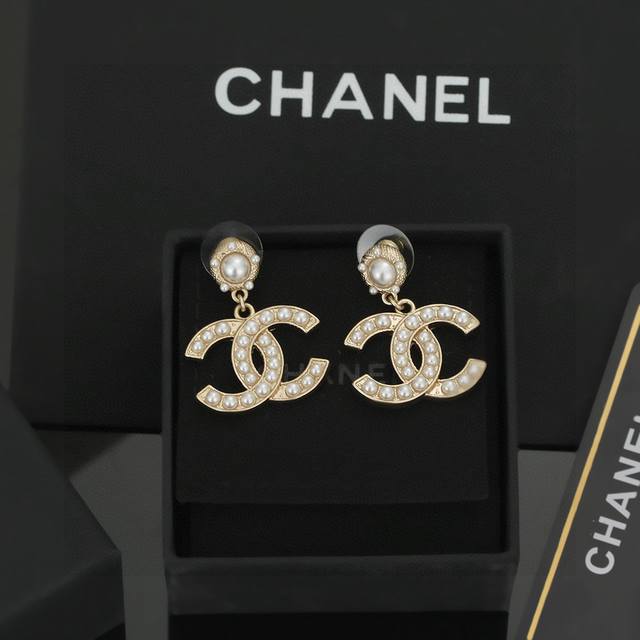 Chanel classic double C pearl stud earrings. These are versatile and stylish, ea