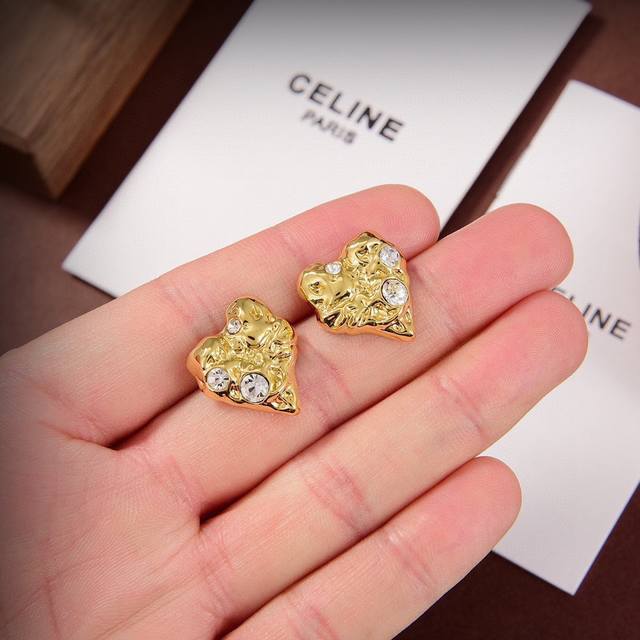 Celine's new heart-shaped earrings feature a unique and distinctive design that