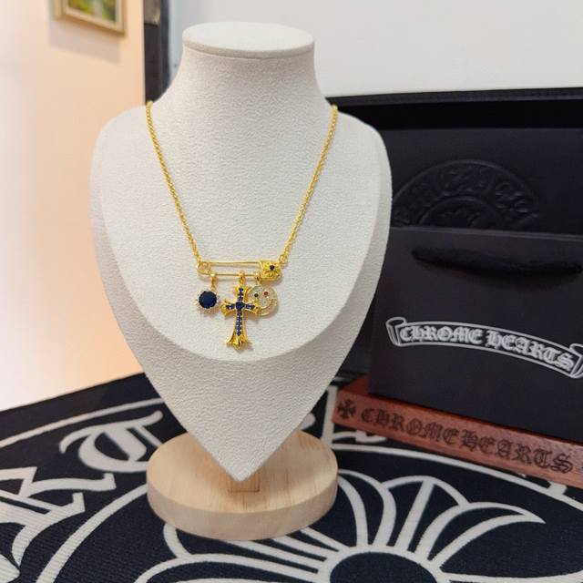 New boutique quality Chrome Hearts brooch blue diamond cross necklace. The embos