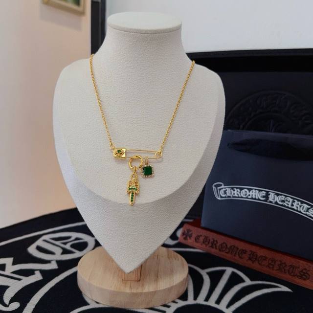 New boutique quality Chrome Hearts brooch with green diamond sword design. The