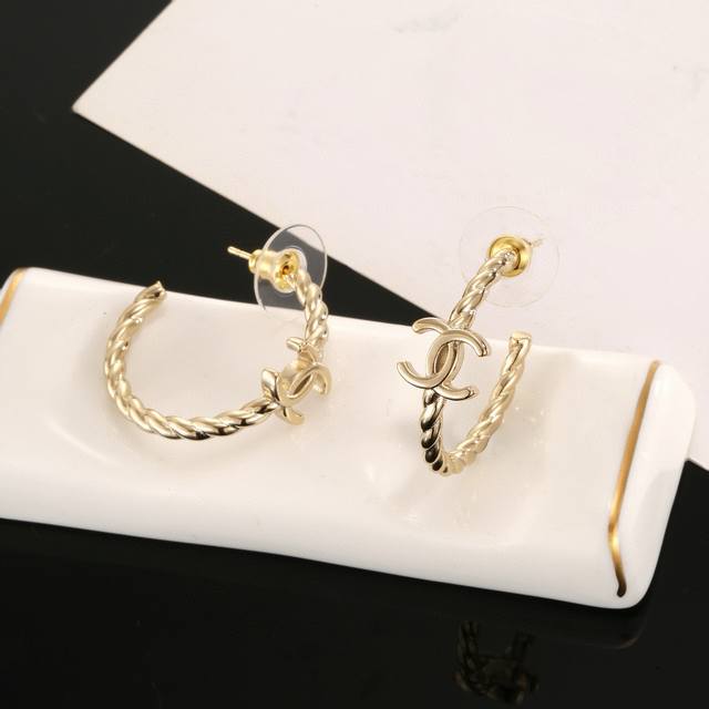 Chanel classic half-circle gold double C stud earrings. These are versatile and