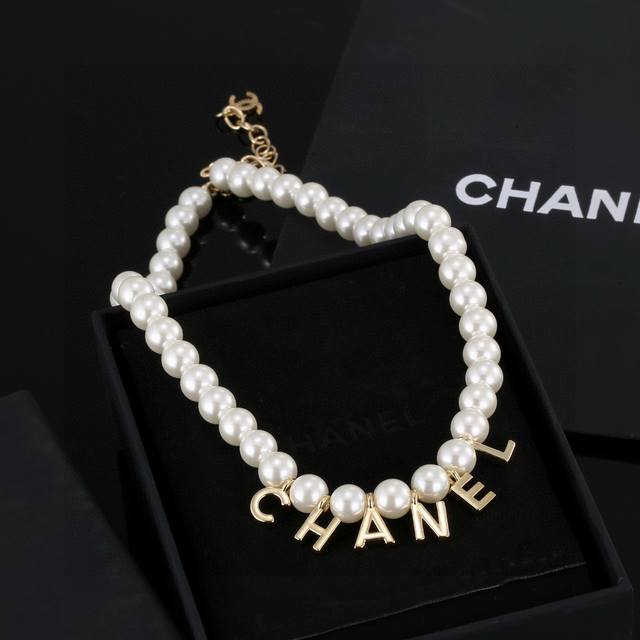 This latest Chanel letter pearl necklace/sweater chain is very beautiful, exqui