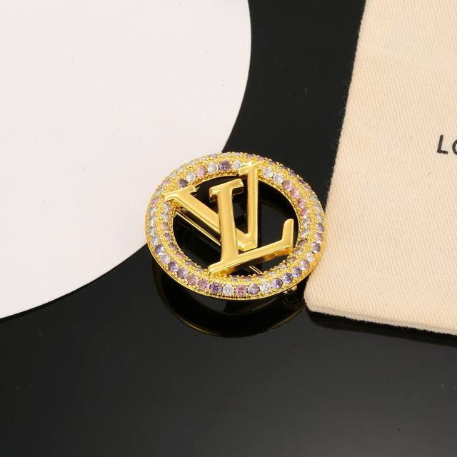 This exquisitely crafted Louis Vuitton brooch embodies superb craftsmanship, us