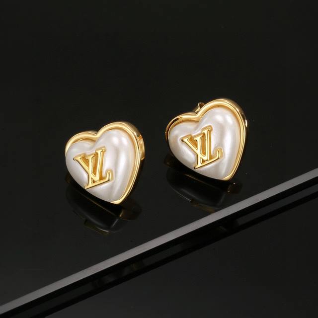 Exquisitely crafted Louis Vuitton heart-shaped resin earrings, embodying superb