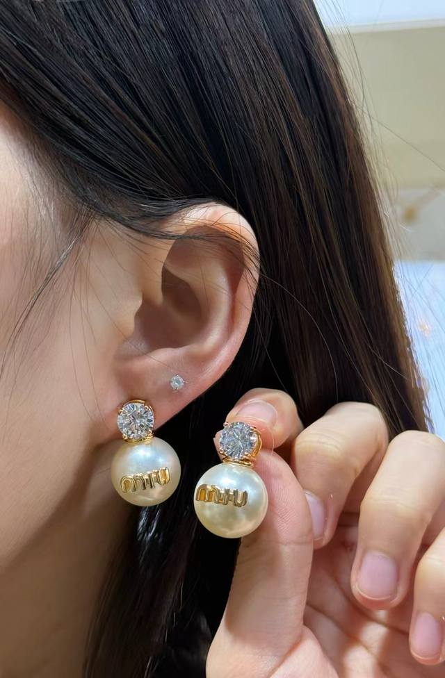 Miu Miu Pearl and Diamond Earrings These Miu Miu pearl and diamond earrings feat