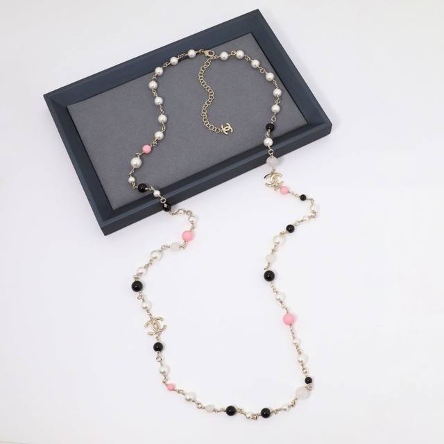 Ch Nel Necklace: A double-layered, double-C colored pearl sweater chain necklace