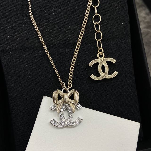 Xx0284 Ch Nel Xiang'er 3D Bow Necklace, Light Gold Bow with Silver Double C Pend
