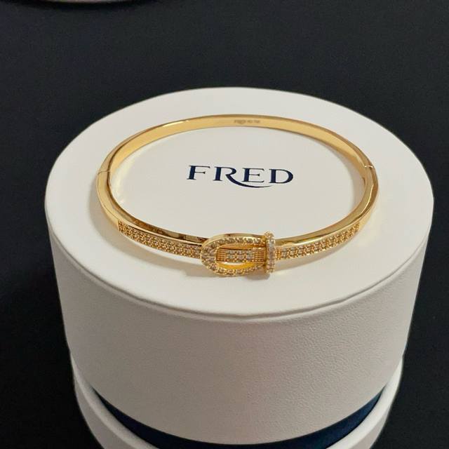 A wildly popular Frederick full-diamond horseshoe clasp bangle, classic and vers