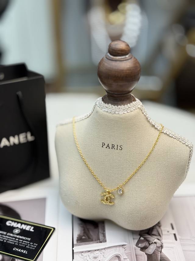Chanel 26p Gold Quilted Cc Necklace This Chanel 26p gold quilted Cc necklace is